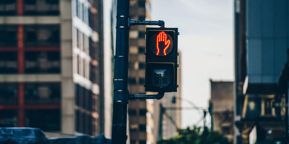 a traffic light showing a red hand