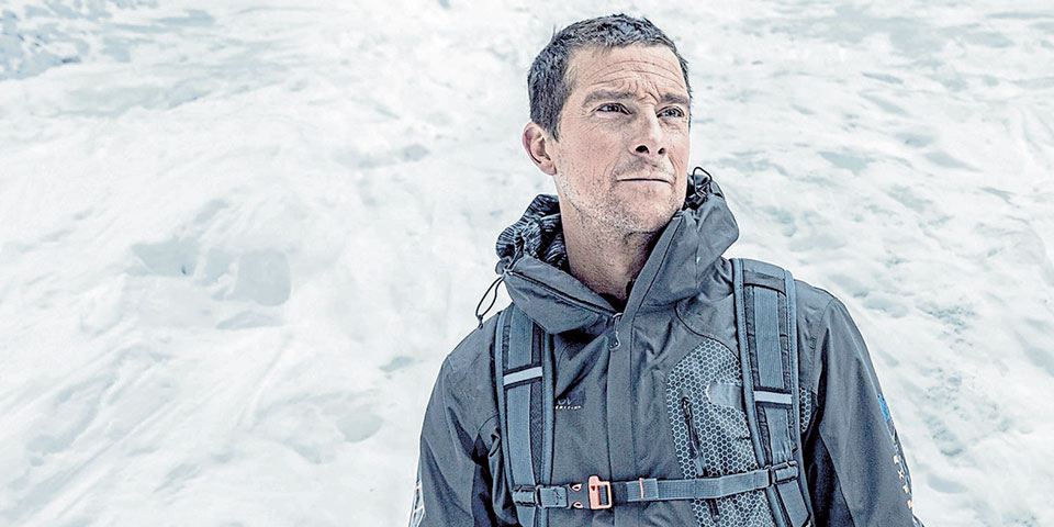 Bear Grylls standing in snow