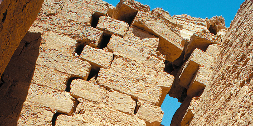 bricks pulling apart in a wall