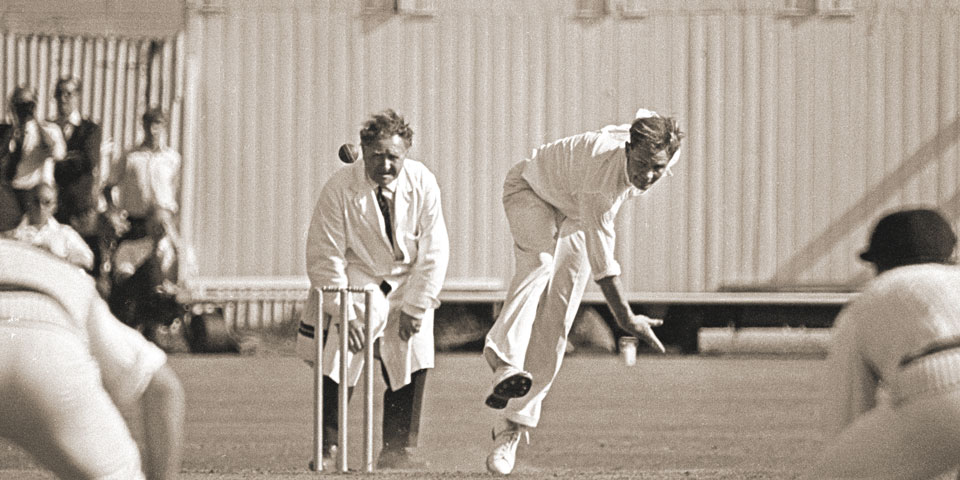 action shot of Peter Pollock bowling a ball