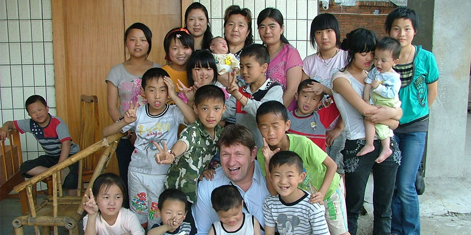 Robert Glover with orphans